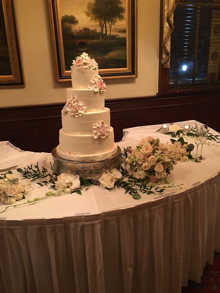 Bridal bouquet placed by cake