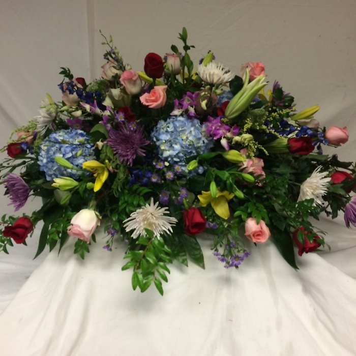 Casket cover of mix flowers with red roses